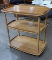 An Ercol Blonde elm and beech Windsor trolley