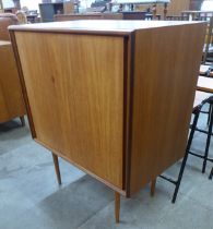 A G-Plan Form-5 teak two door cabinet on stand