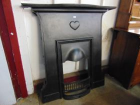 An Art Nouveau cast iron chimney-piece