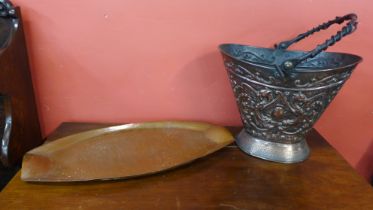 An Arts and Crafts hammered copper tray and a coal scuttle