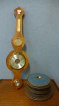 A beech aneroid barometer and a foot warmer