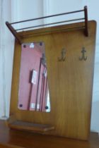 A teak wall hanging hall mirror/coat rack