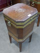 A Regency mahogany and brass bound octagonal wine cooler on stand