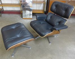 A Charles & Ray Eames style simulated rosewood and black leather revolving lounge chair and ottoman