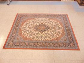 A terracotta ground rug