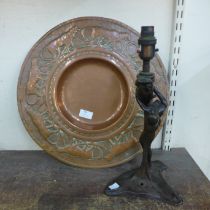 A French Art Nouveau bronze effect female nude table lamp and a copper charger