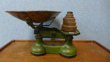 A set of painted cast iron kitchen scales