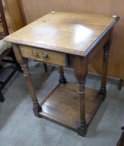 A George III style oak single drawer lamp table