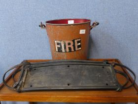 A pair of 1930s John Bull trade plate holders and a fire bucket