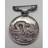 A medal marked Lord, Save Us, We Perish, awarded to J.R. Carnon, 2nd officer, S.S. Philadelphian