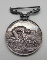 A medal marked Lord, Save Us, We Perish, awarded to J.R. Carnon, 2nd officer, S.S. Philadelphian