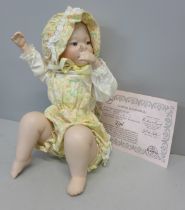 An Edwin M Knowles limited edition 'piano baby' doll, boxed with certificate