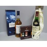 Two bottles of whisky, Talisker Single Malt, Glenlivet Single Malt and a Glenfiddich set of single