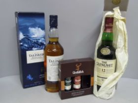 Two bottles of whisky, Talisker Single Malt, Glenlivet Single Malt and a Glenfiddich set of single