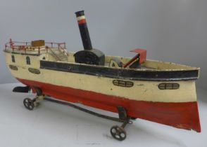 A Victorian pressed steel clockwork paddle steamer pond yacht, incomplete, 50cm