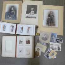 Two Victorian photograph albums containing carte de visites and cabinet cards, both incomplete and