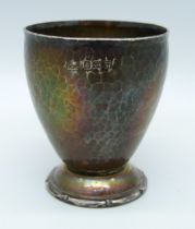 A hammered silver egg cup, A.H. Jephcot, 54g