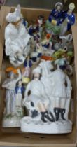 A collection of Staffordshire figures including a Robin Hood flatback, spill holders, small