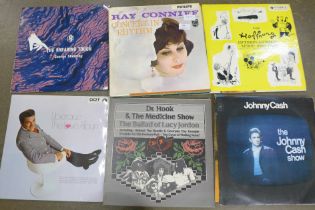 A collection of LP records including Elvis Presley, Frank Sinatra and Johnny Cash