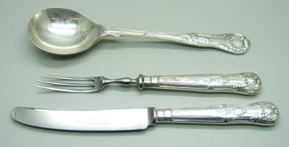 A silver spoon, 63g and a silver handled pastry knife and fork