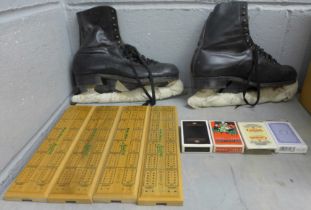 A pair of ice skates, four cribbage boards and two packs of playing cards **PLEASE NOTE THIS LOT
