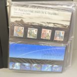 An album of 56 original complete stamp sets of First Day Presentation Packs in sequence from the