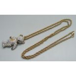 A Vivienne Westwood articulated Teddy bear pendant and chain, with pouch, (area of glue on the