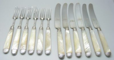 Six silver knives and forks with mother of pearl handles, knives bear initials