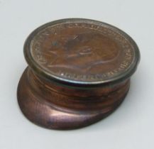 A WWI trench art peaked cap with inset coin