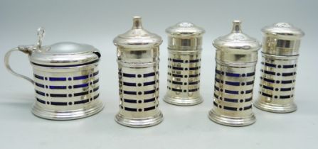 Two silver salt and pepper pots and a silver mustard pot, Birmingham 1929