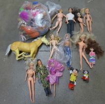 A box of vintage Barbie dolls, vintage Trolls, Action Man and a model horse