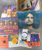 Seven 12" LP records including Sweet double album, Roxy Music and ELO plus fifty-four 7" singles,