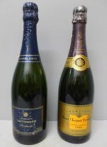 A bottle of Taittinger Champagne Prélude and a bottle of Veuve Cliquot Ponsardin Champagne 1998 **