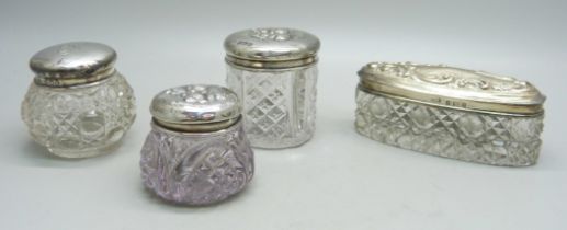 Two silver top jars, Birmingham 1902 and 1907 and two others decorated with Reynolds angels