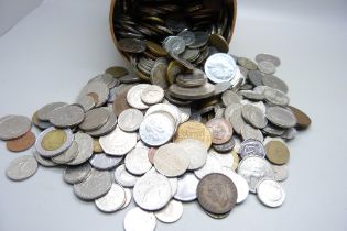 A tin of mixed foreign coins
