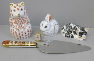Three Royal Crown Derby paperweights, two with gold stoppers, a thimble and an Imari cake server