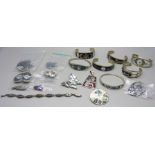 A collection of silver, alpaca and other jewellery, seven bangles, seven pairs of earrings, two