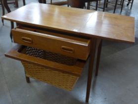 A Danish teak and wicker drop leaf lady's sewing table