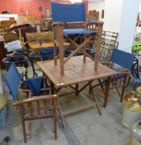 A teak garden table and four chairs