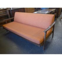 A Guy Rogers teak and orange fabric upholstered sofa bed, designed by Eric Fejer and Eric Phamphilon