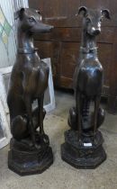 A pair of large French style bronze figures of seated greyhounds