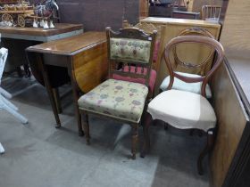 An oak drop-leaf table, a pair of Victorian mahogany balloon back dining chairs and a pair of Edward
