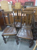 A set of four carved oak barleytwist dining chairs