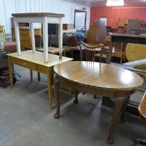 An Edward VII oak oval dining table, an oak occasional and a pine kitchen table