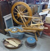 A beech spinning wheel, a clothes washboard, a copper pan, a walnut barometer, etc.