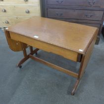 A Jentique teak drop-leaf coffee table