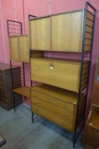 A Staples teak and black metal two bay Ladderax room divider