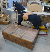 A beech and felt childs rocking horse and a vintage steamer trunk