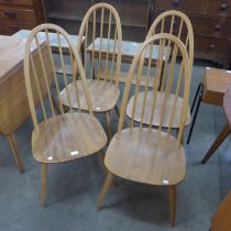 A set of four Ercol Blonde elm and beech Quaker chairs