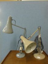 Two vintage Herbert Terry metal anglepoise desk lamps and an original box